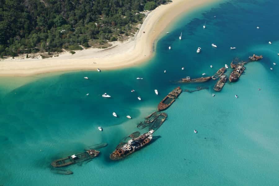 Moreton Island: Tangalooma Snorkel Tour with Helicopter Tour - Guided snorkel tour at The Wrecks: what you’ll experience in the water